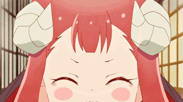 a close up of a girl 's face with horns