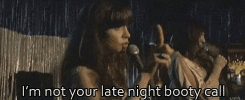 a woman singing into a microphone with the words i 'm not your late night booty call written below her