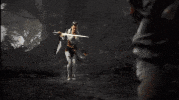 a woman with wings is flying through the air holding a sword