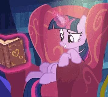 twilight sparkle sits in a chair next to a book