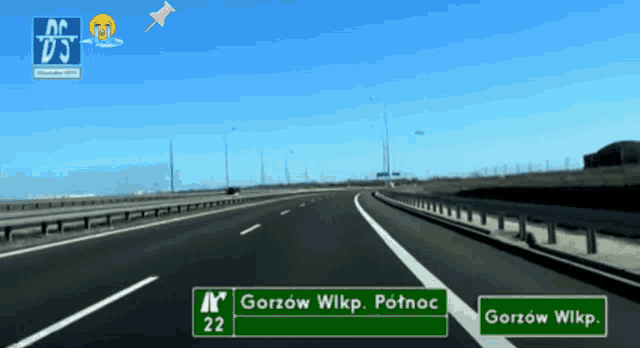 a highway with a green sign that says gorzow wlkp. potnoc