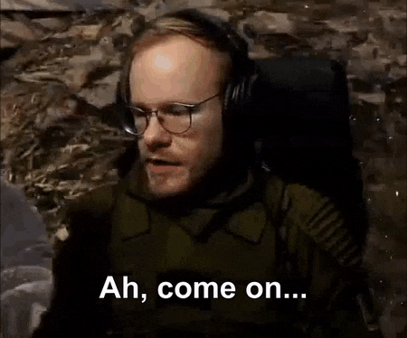 a man is laying down in a chair with the words `` ah , come on ... '' written on the screen .