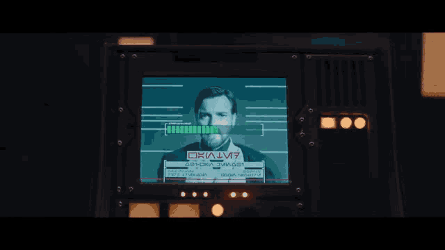 a man 's face is on a screen that says okajj7 on it