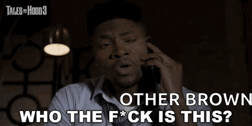 a man talking on a cell phone with the words " other brown who the f * ck is this "