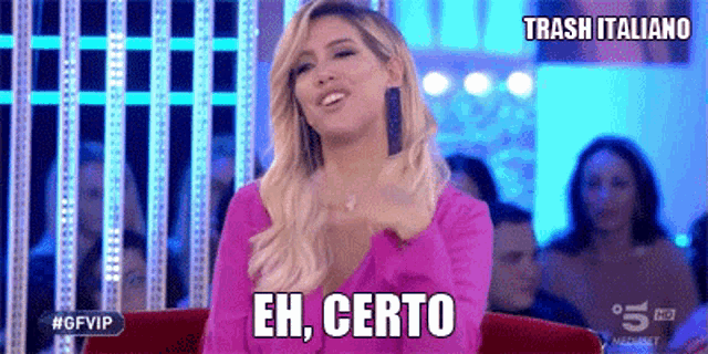 a woman in a pink top says eh certo on a tv show