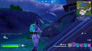 a person is playing a video game with a gun in their hand .