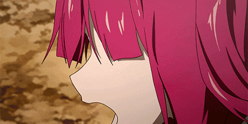 a close up of a girl 's face with red hair
