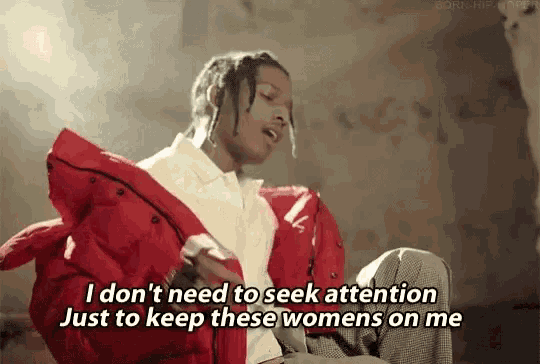 a man in a red jacket is sitting down and saying i don t need to seek attention just to keep these womens on me