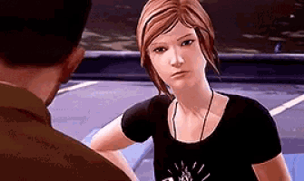 a woman is talking to a man in a video game while wearing a black shirt .