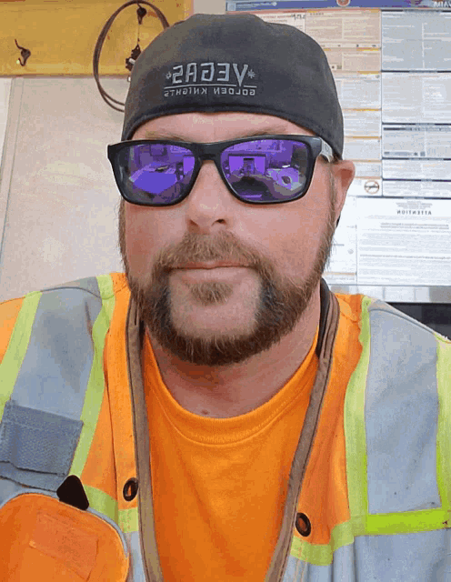 a man wearing sunglasses and a hat that says " 2a33v " on it