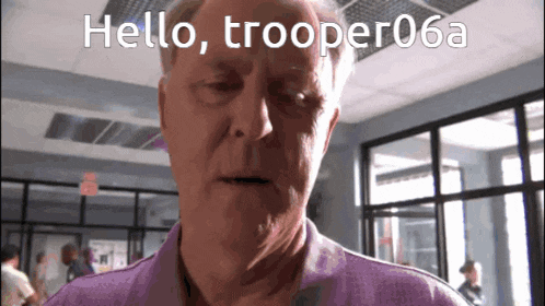 a man in a purple shirt says hello trooper06a on the screen