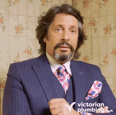 a man in a suit and tie with victorian plumbing written on the bottom