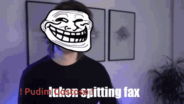 a man with a troll face on his head and the words " pudim takes spitting fax "