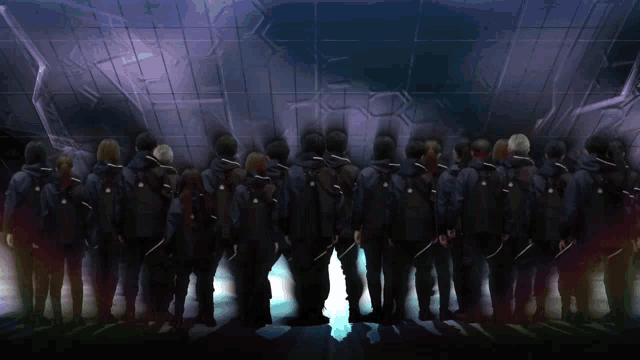 a blurred image of a group of people standing in a dark room