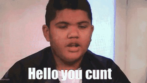 a young man is making a face and saying hello you cunt