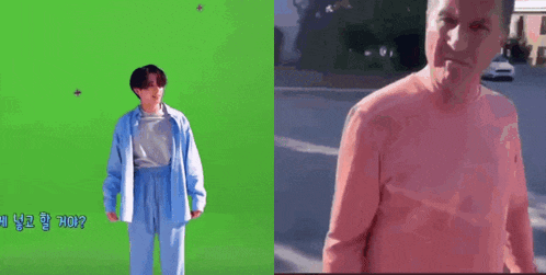 a man in a pink shirt is standing next to a man in a blue shirt on a green screen .