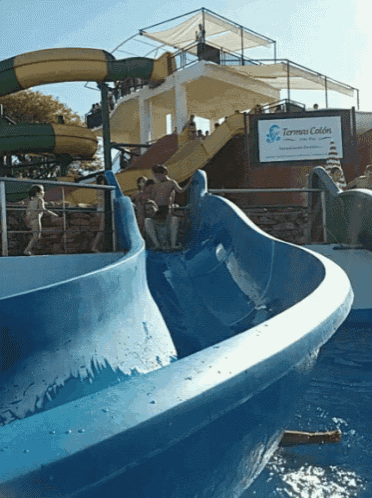 a water slide with a sign that says termas colon on it