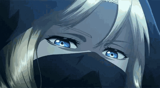 a woman with blonde hair and blue eyes is wearing a black mask on her face
