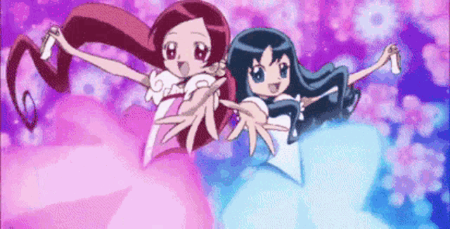 two cartoon girls are flying in the air holding hands