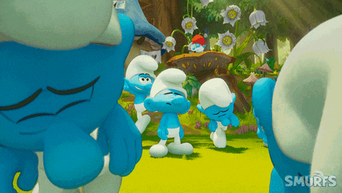 a group of smurfs standing in a field with the word smurfs on the bottom