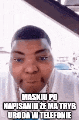 a man is wearing a mask and making a funny face .