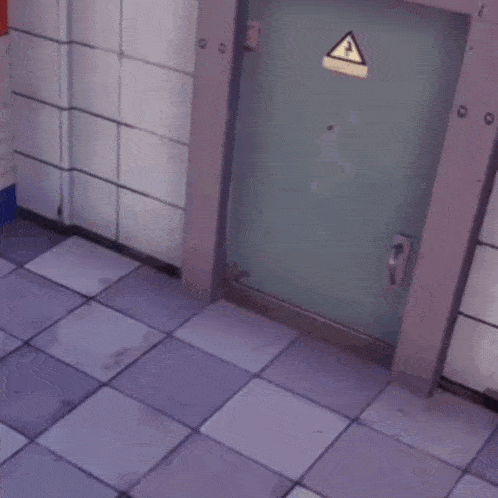 a person in a yellow jacket is walking through a checkered floor
