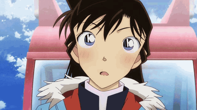 a close up of a girl 's face with the letter k on it