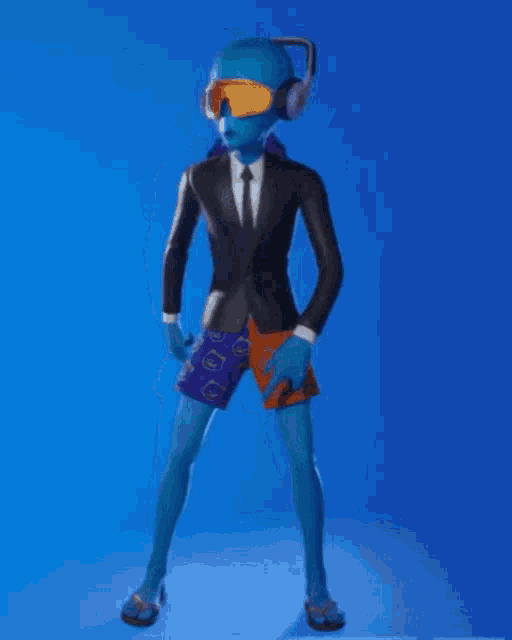 a man in a suit and shorts is wearing headphones and goggles .