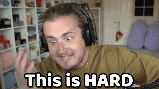 a man wearing headphones says " this is hard " in a video