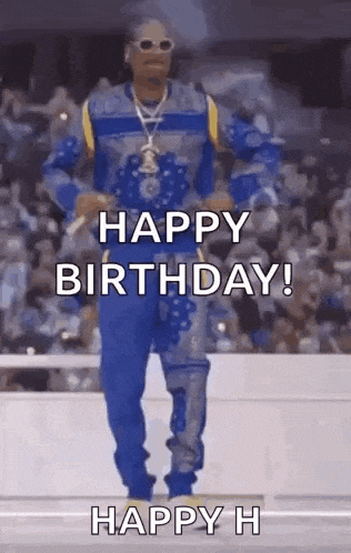 snoop dogg is dancing in front of a crowd and says `` happy birthday ! ''