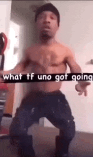 a man without a shirt is dancing in a room with the words `` what tf uno got going '' written on it .