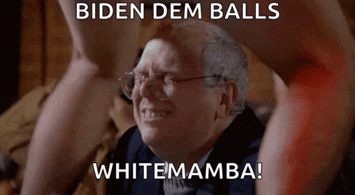 a man with glasses is sitting in front of a naked man 's legs and says biden dem balls whitemamba .