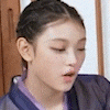 a close up of a young woman 's face with her eyes closed .