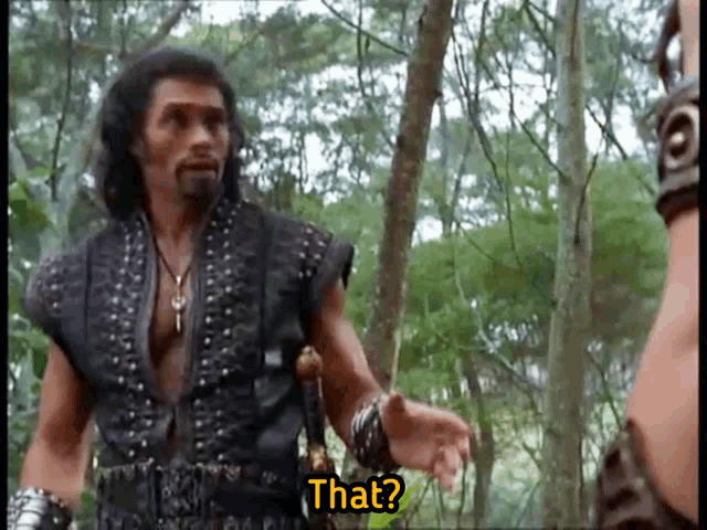 a man with a beard is talking to another man in the woods and says that
