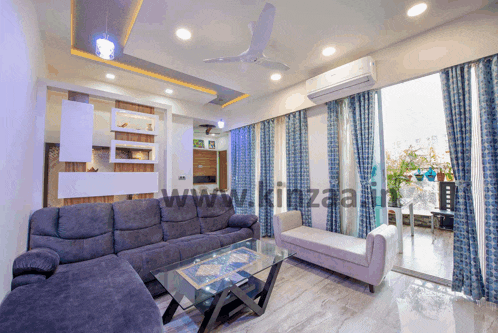a living room with the website www.kinzaa.in on the bottom right