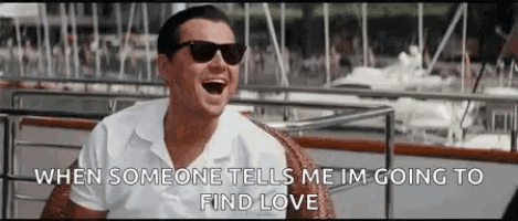 a man wearing sunglasses is laughing while sitting on a boat and someone tells him he is going to find love .