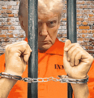 a man in a prison uniform with the letters im on his shirt