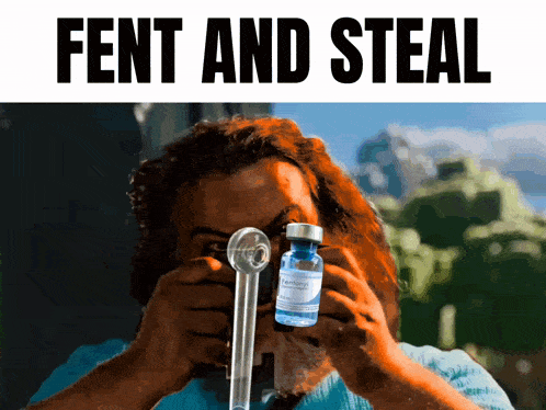 a man is holding a bottle of fentanyl and a pipe