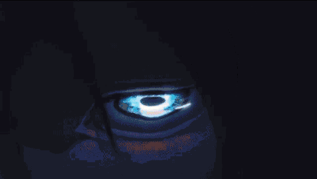 a close up of a woman 's blue eye