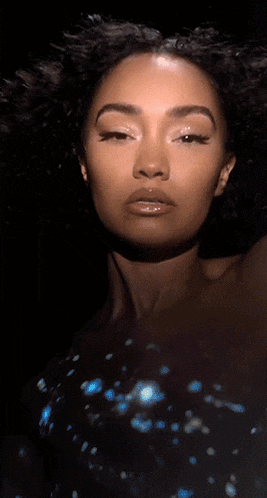 a close up of a woman 's face with a shadow on her neck