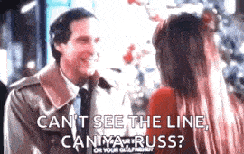 a man and a woman are standing next to each other and talking .