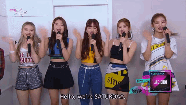 a group of girls singing in front of a sign that says come back