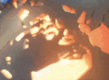 a blurred image of a person holding a piece of paper