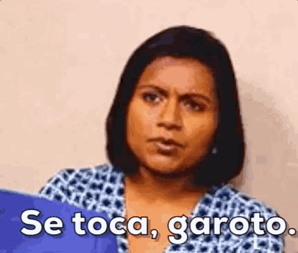 a woman in a leopard print shirt is making a funny face and saying se toca garoto .