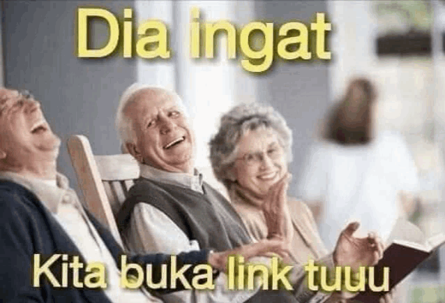 a group of older people are sitting in rocking chairs laughing .