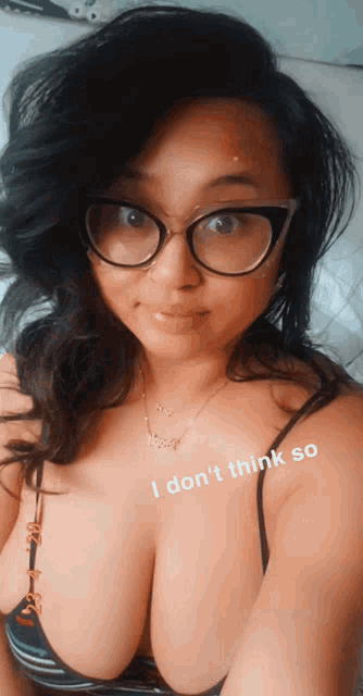 a woman wearing glasses and a necklace with the words i don 't think so on the bottom