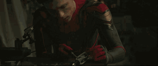 a close up of a man in a spider-man suit