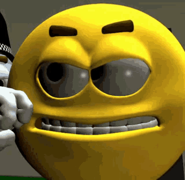a close up of a smiley face with a fist in it