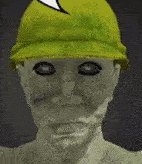 a close up of a person wearing a green hat with a speech bubble on it .