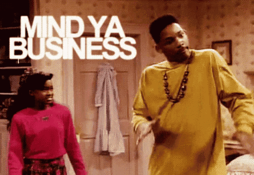 a man and woman are dancing in a room with the words mind ya business behind them
